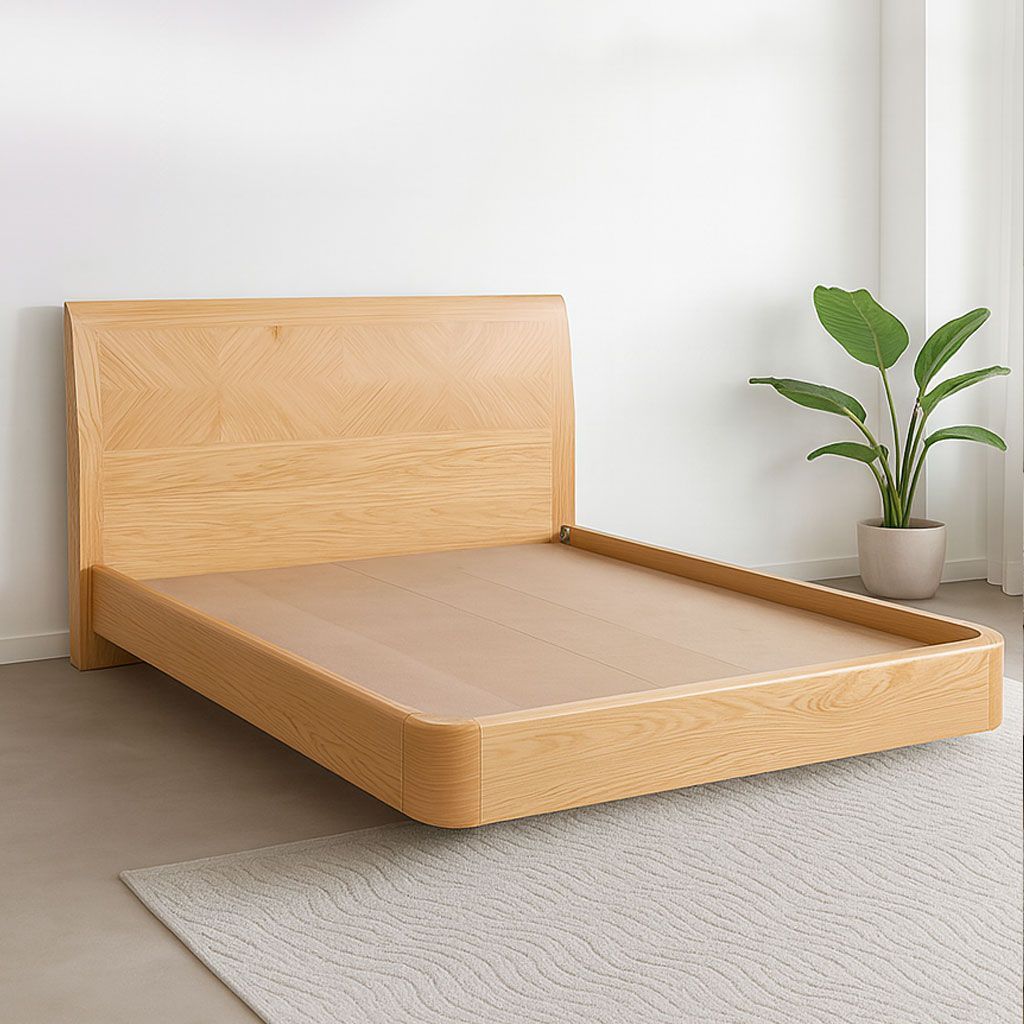 Cama minimalista de madera con mesitas de noche a juego en un dormitorio luminoso y austero.