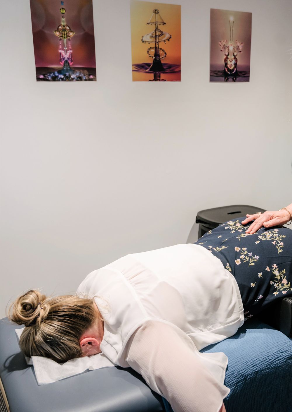 Young Female Receiving Massage From Therapist — Spinal Flow Technique in Newcastle