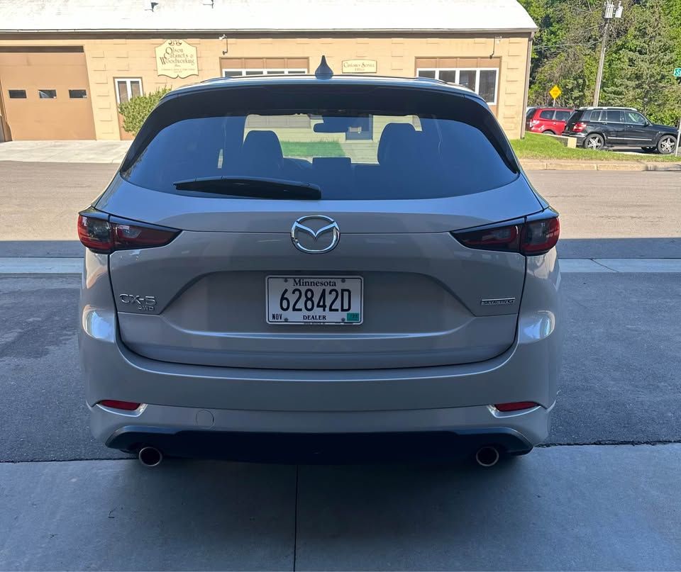 A silver car with a license plate that says 628420