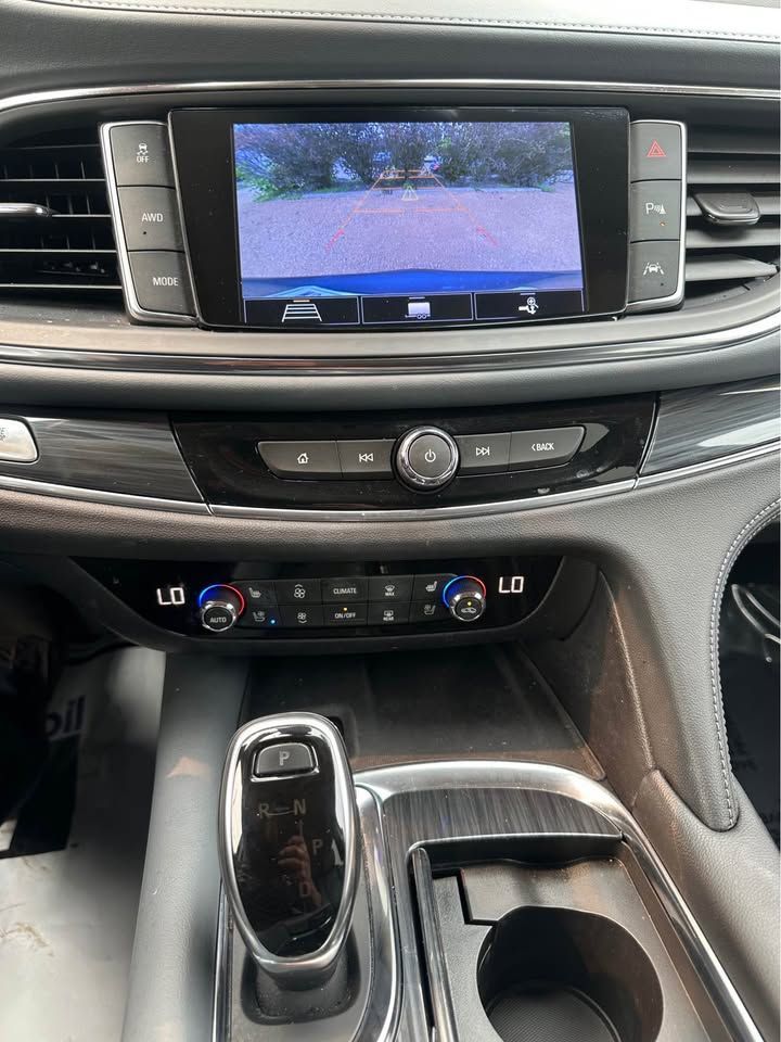 A close up of the dashboard of a car with a rear view camera.