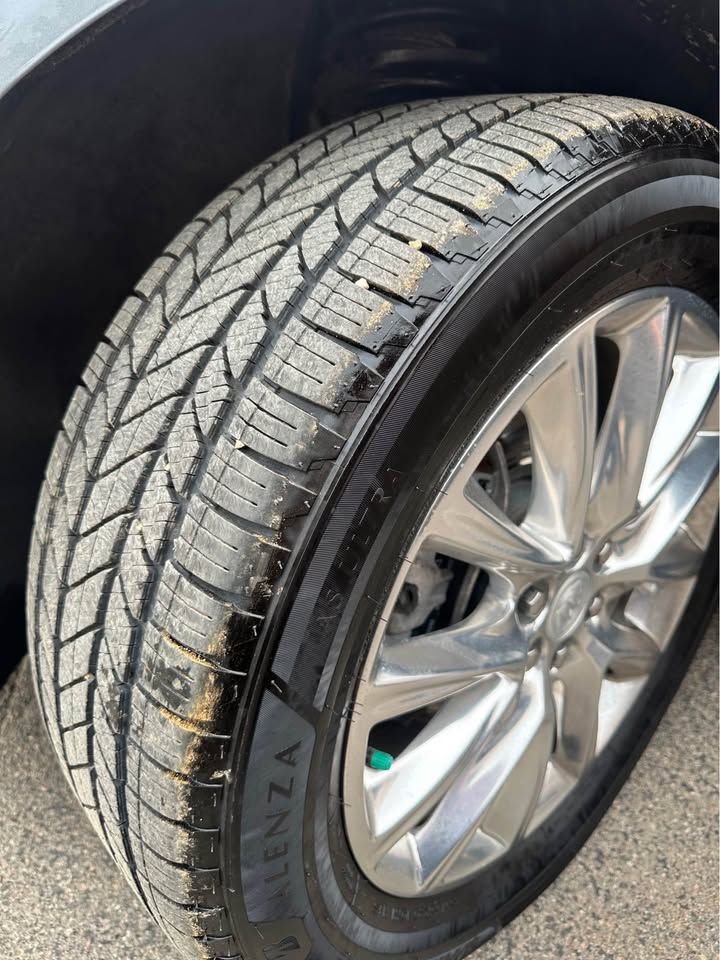 A close up of a tire on a car.