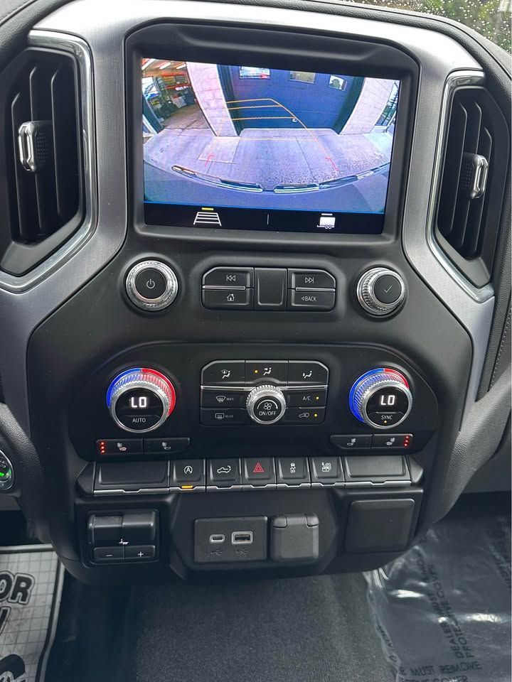 A close up of a car dashboard with a rear view camera.