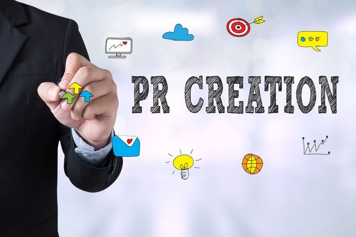 Hand in suit drawing a chart beside “PR CREATION” text and small marketing icons on a white background