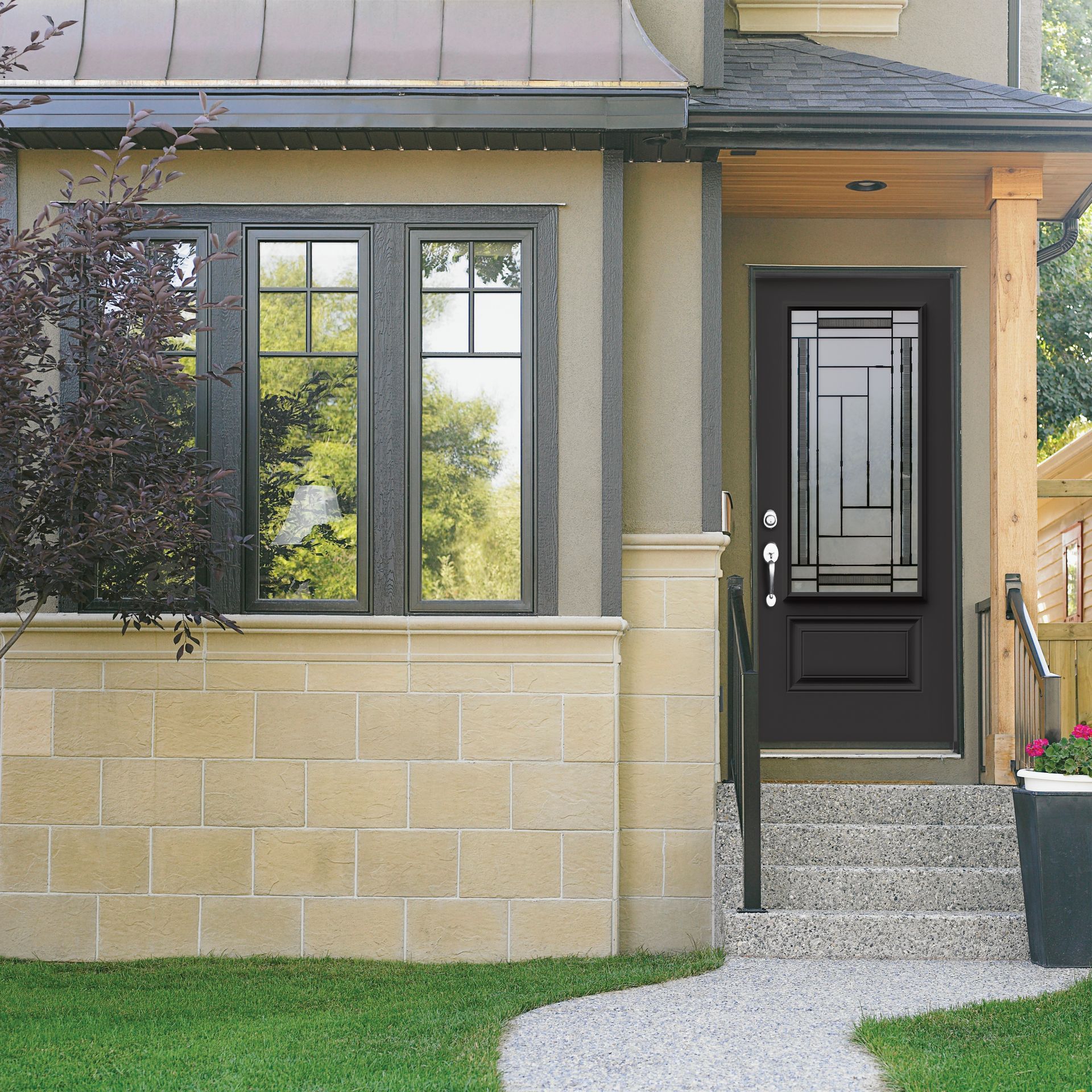 Beige brick facade with black window and door. The door features a glass design and leads to a small porch with steps.