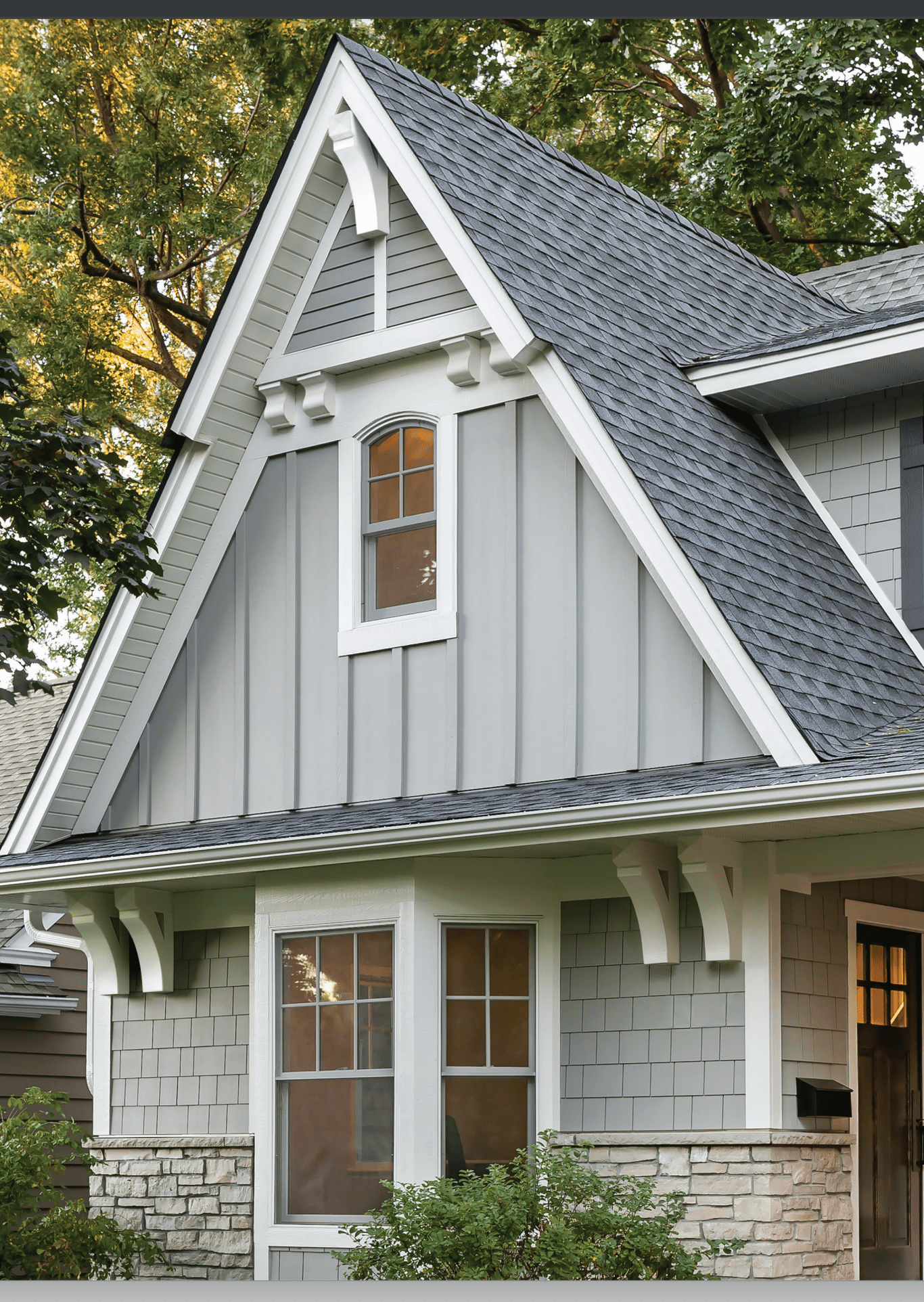 A house with a gray roof and white trim