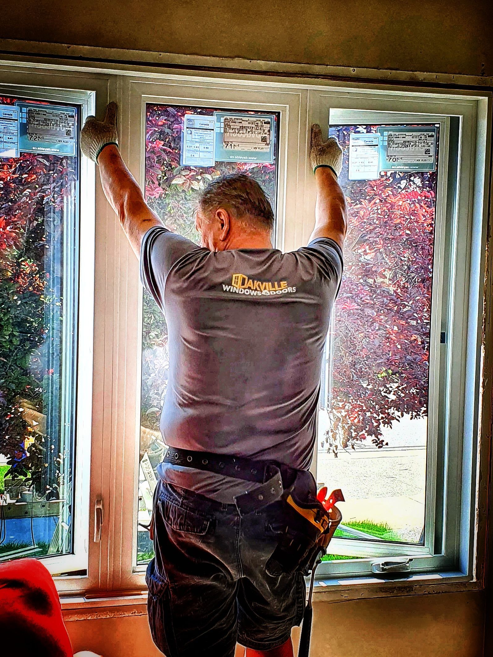 a man is installing a window in a house