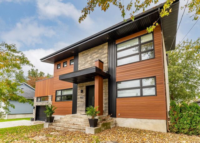 A large house with a lot of windows and stairs