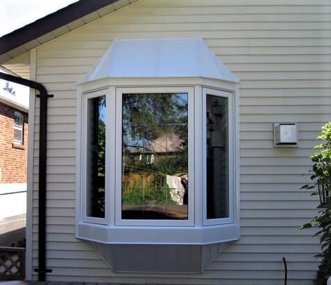 A bay window on the side of a house