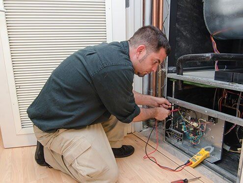 HVAC Contractors — Man Repairing HVAC — Albany, GA