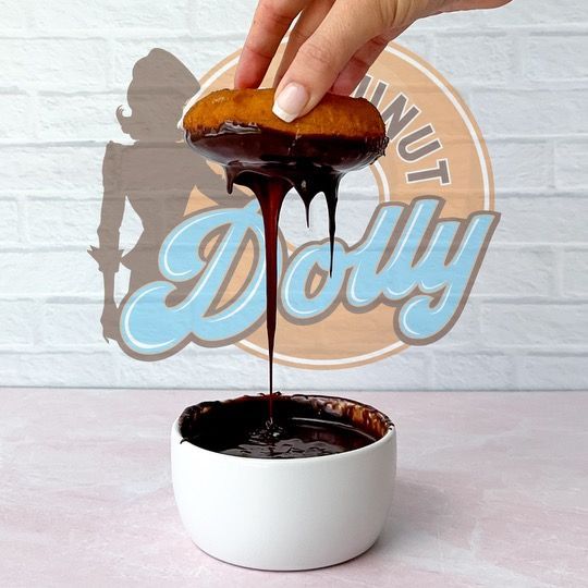 A boy and a girl are holding donuts in their hands