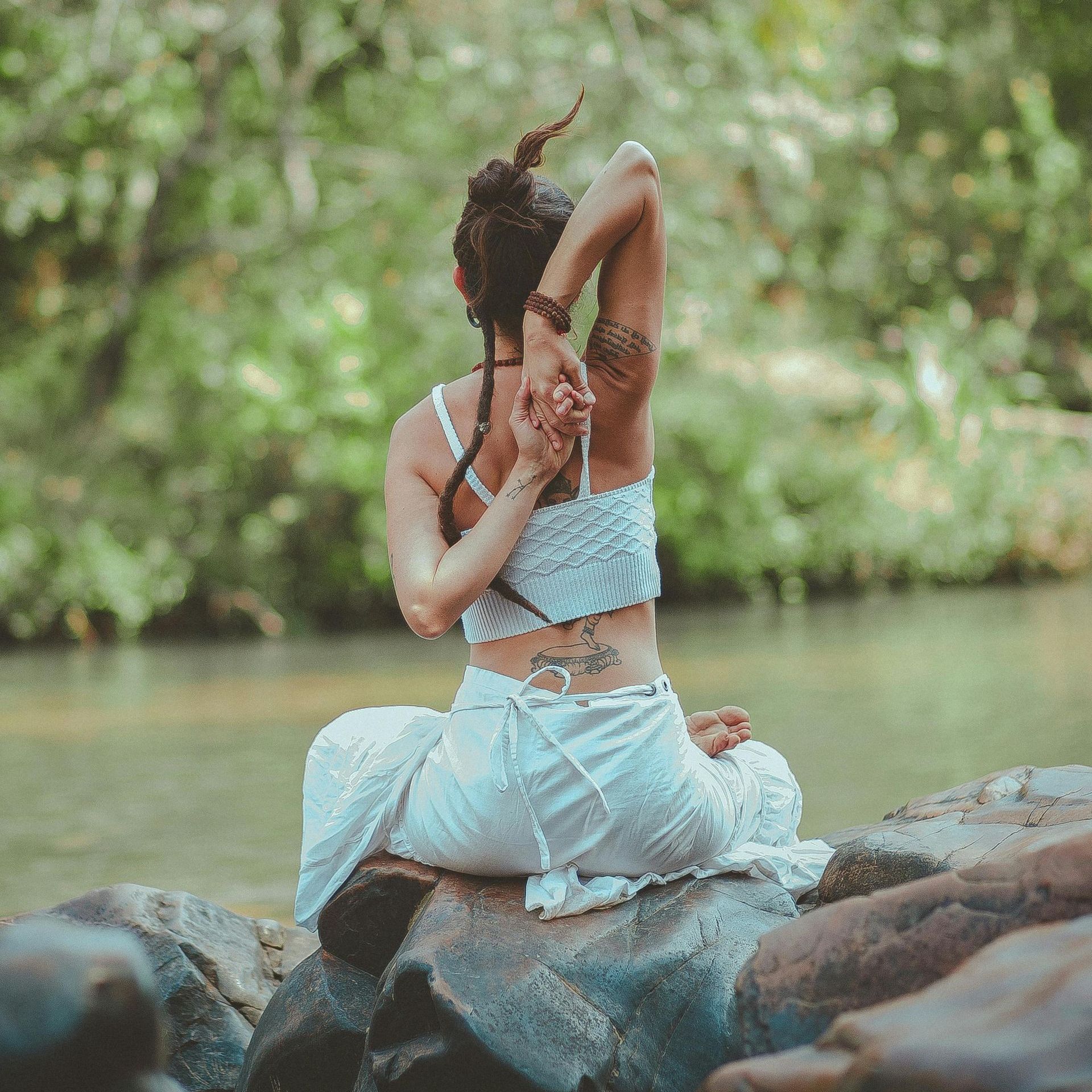 A woman streching getting ready for yoga