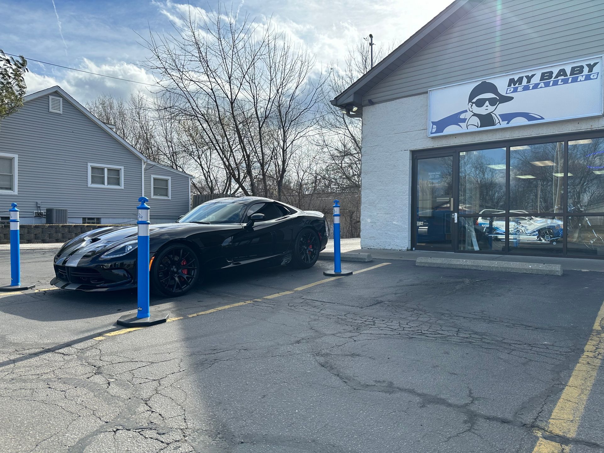Black sports car parked in front of