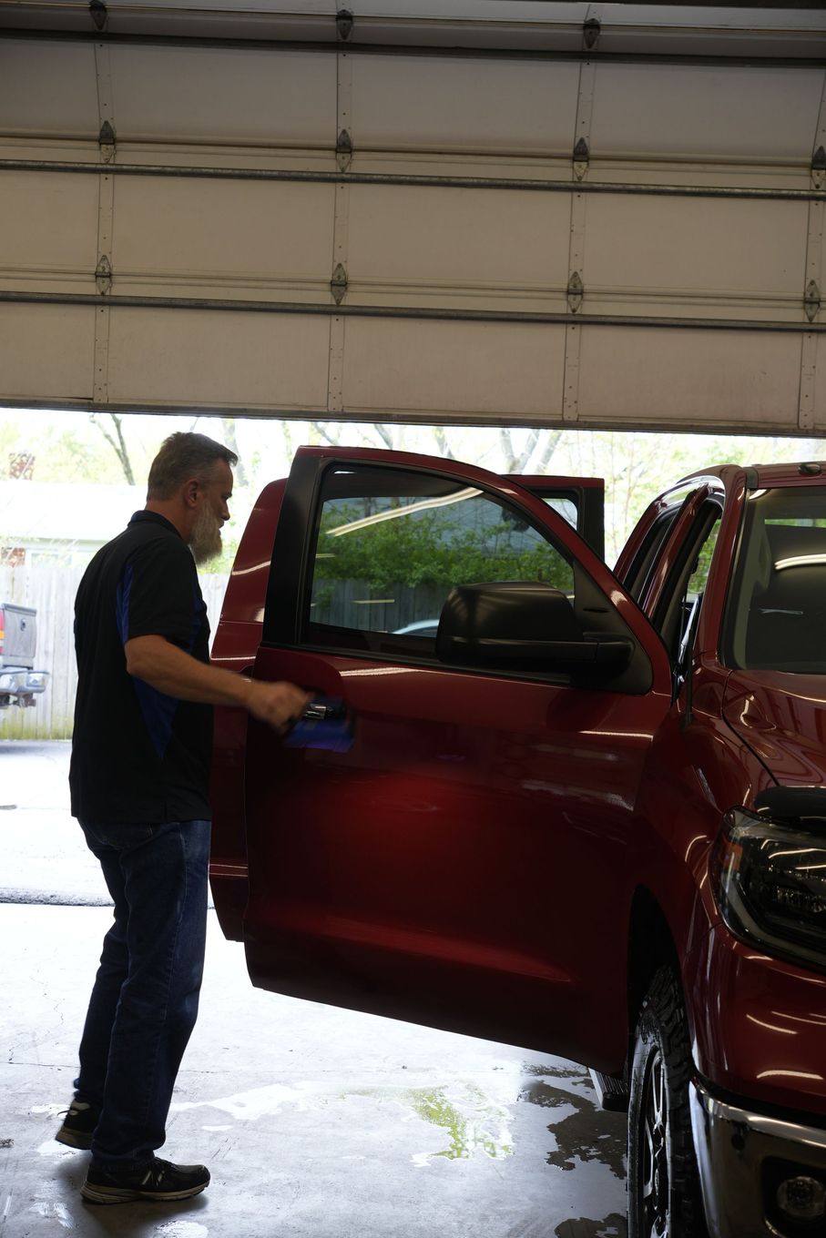 A person is adjusting the steering wheel of a car