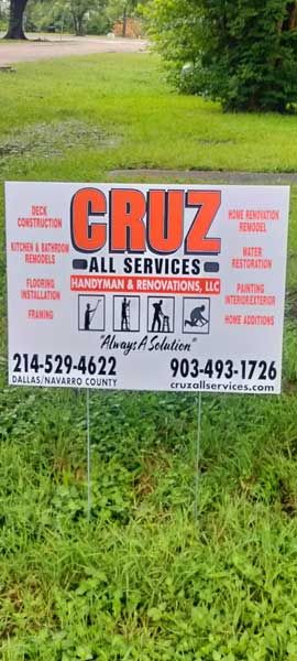 A white yard sign for 