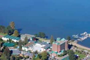 An aerial view of a city next to a body of water.