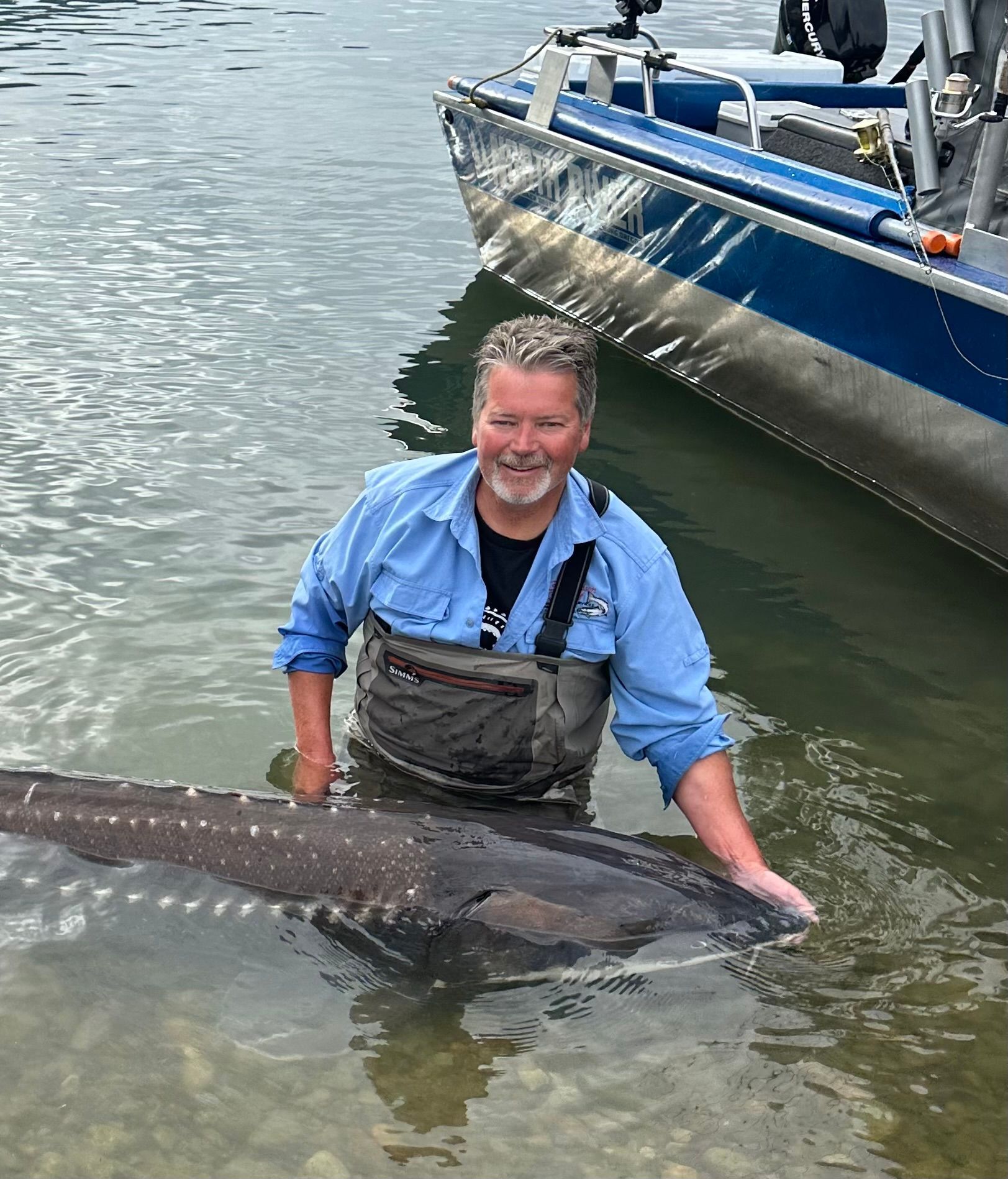 A man with sturgeon