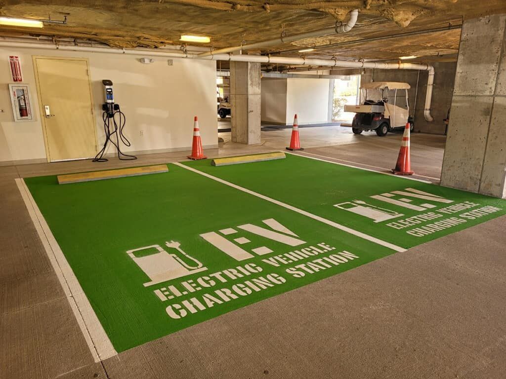 An electric vehicle charging station in a parking garage