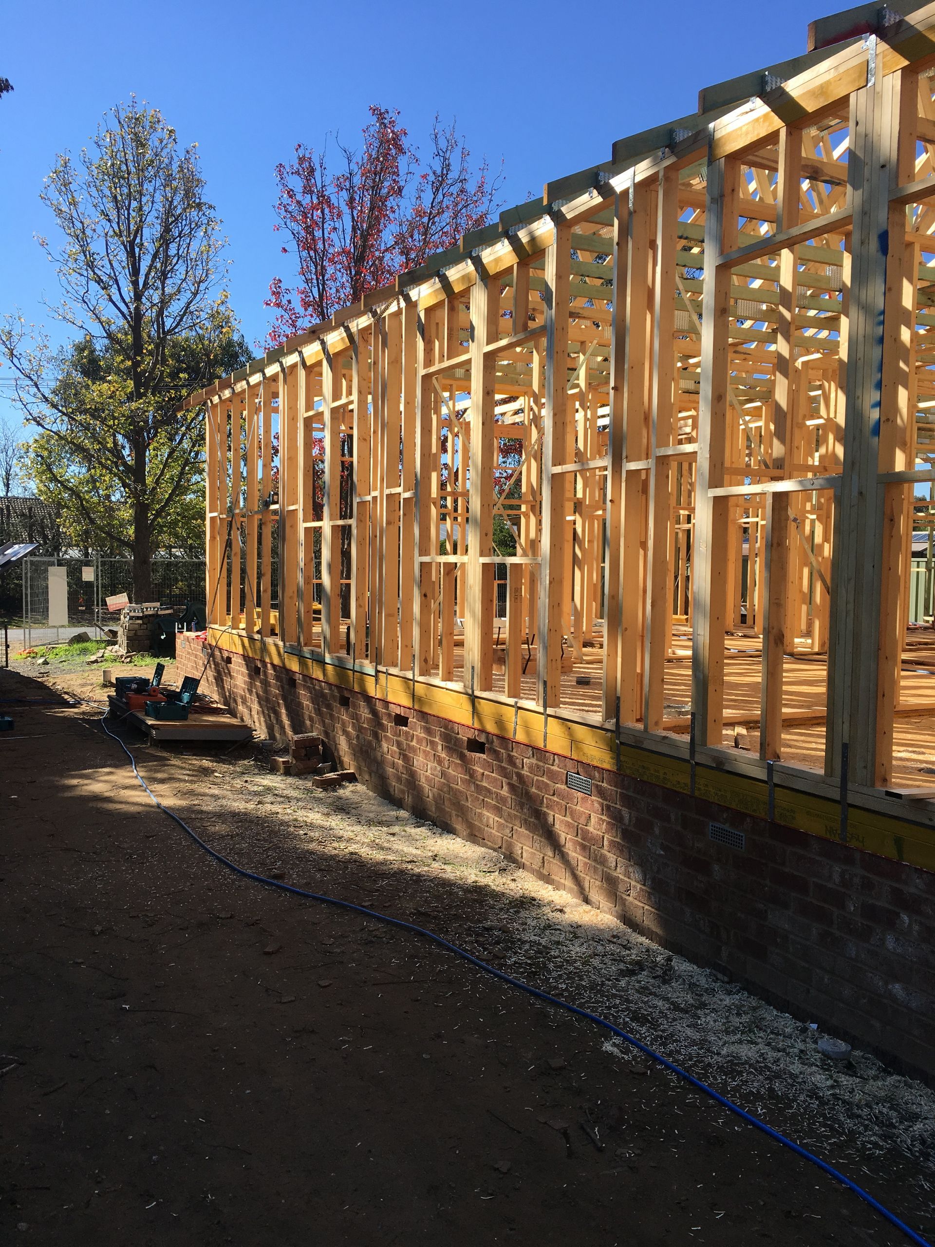 A building is being built with a lot of wooden frames