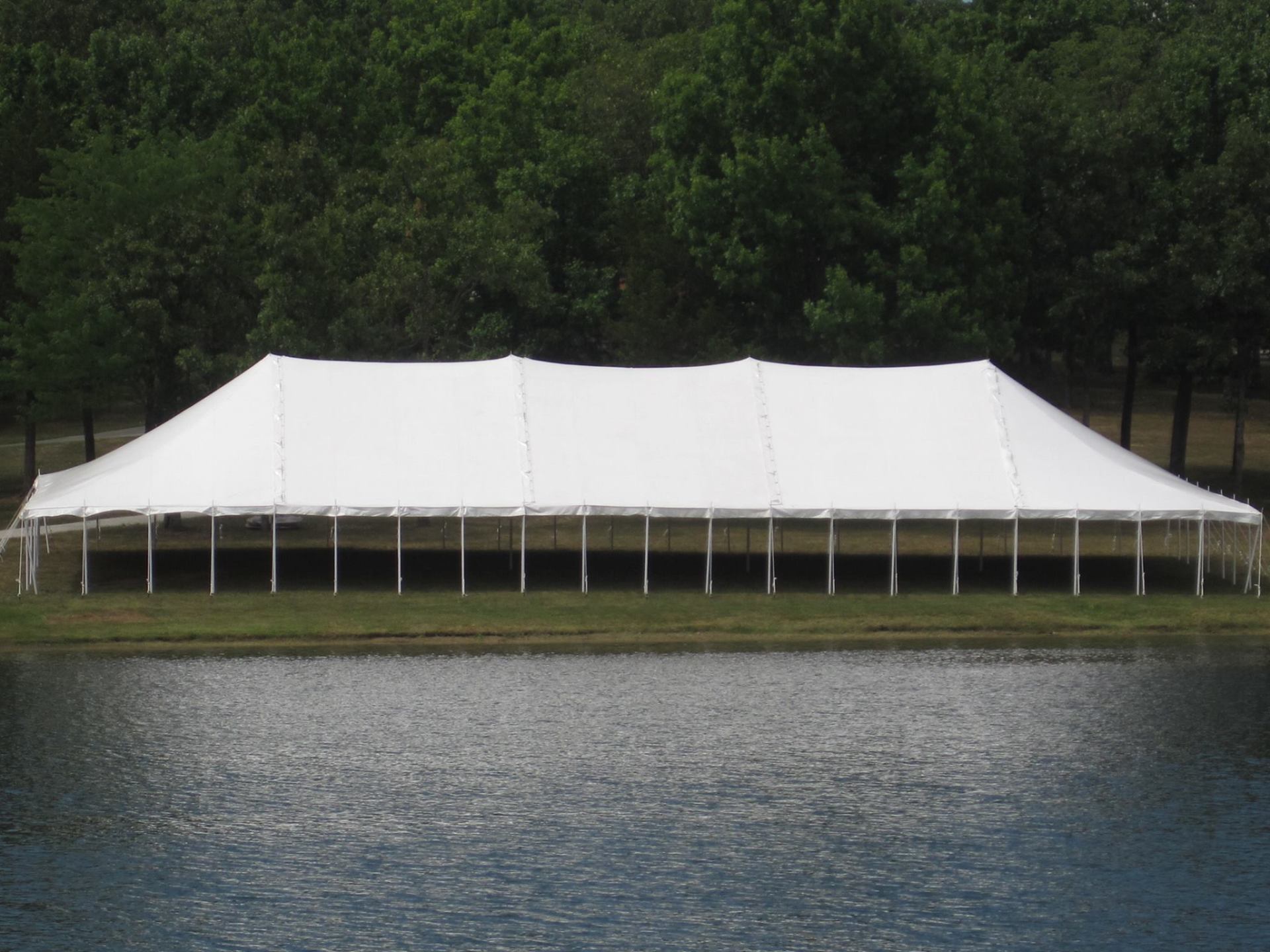 Commercial Tent — Tent Rental Setup Beside River in Vernon, MO
