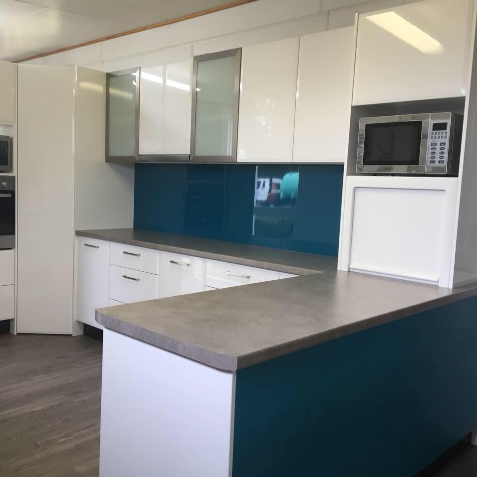 A Kitchen With White Cabinets And Grey Counter Tops - Standfast Cabinets In Tuggerah, NSW