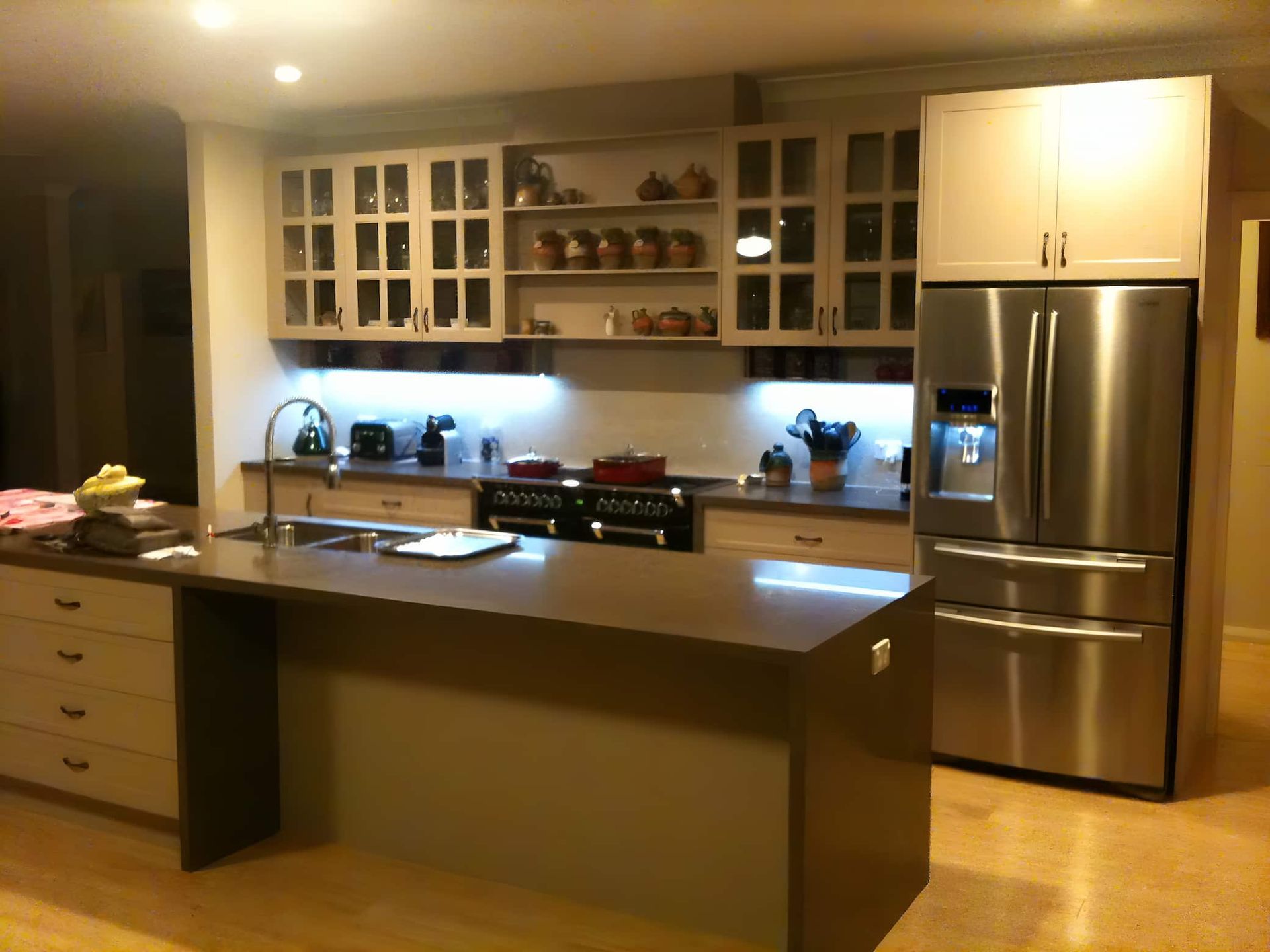 A Kitchen With Stainless Steel Appliances And White Cabinets — Standfast Cabinets In Tuggerah, NSW