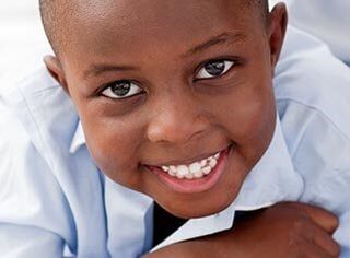 Young Boy Smiling — Child Development Centers  in Detroit, MI