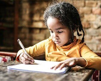 Young Girl Writing — Child Development Centers  in Detroit, MI