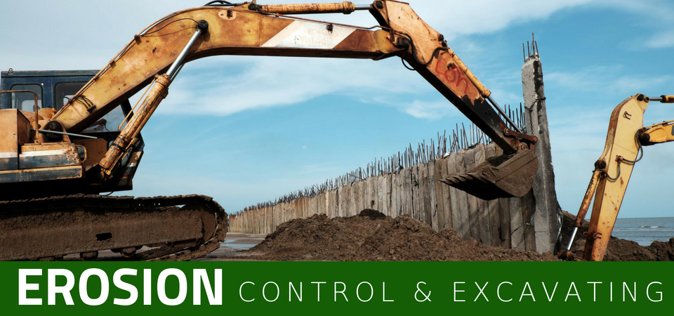 Two excavators work at a construction site with a concrete wall, with the text 