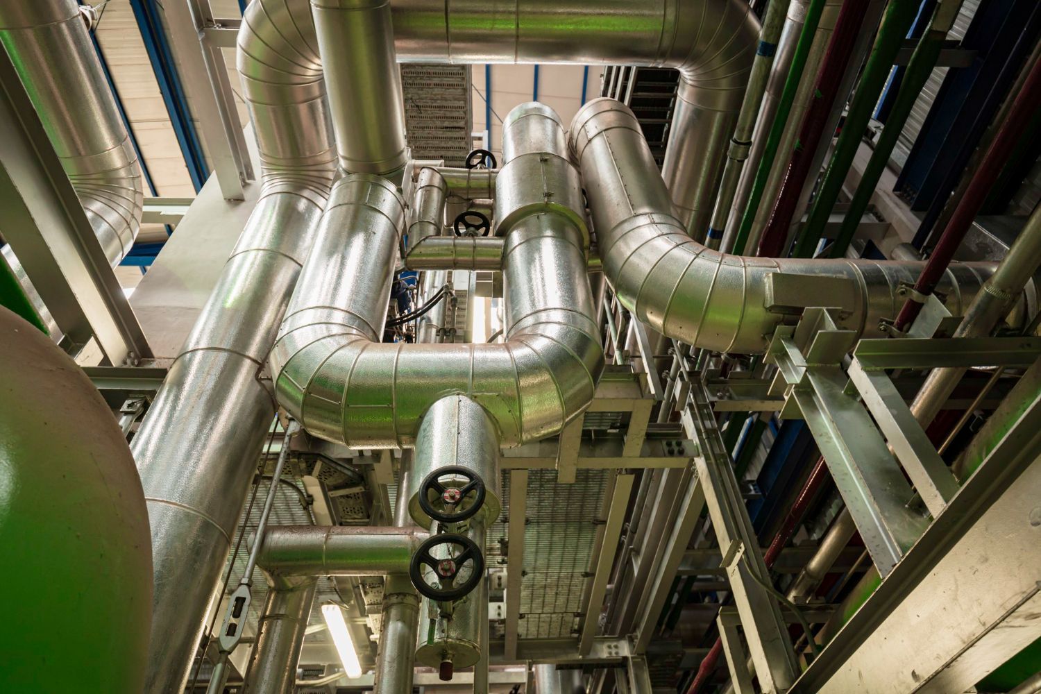 A bunch of pipes are connected to each other in a factory.