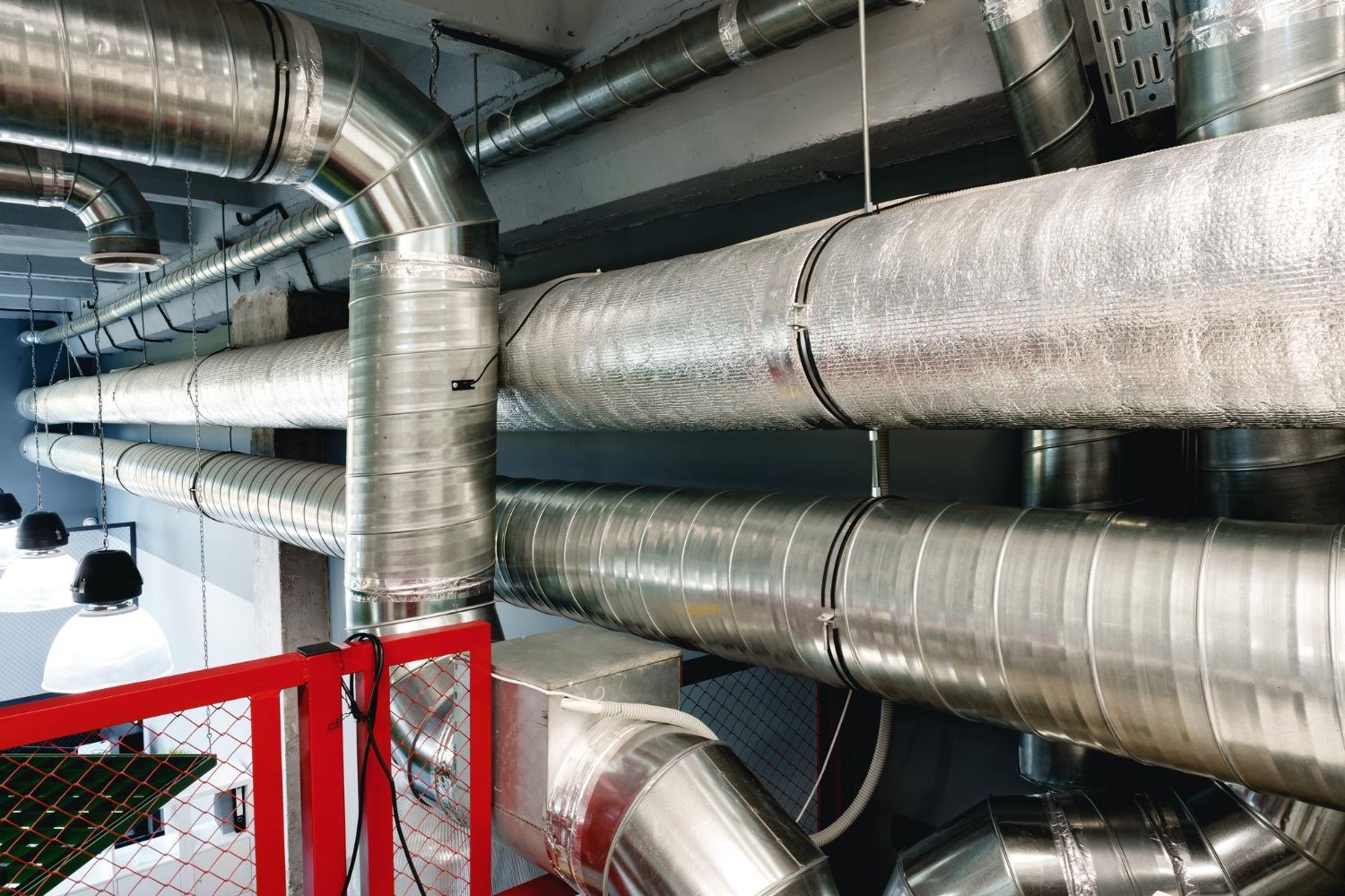 A room filled with lots of metal pipes and ducts.