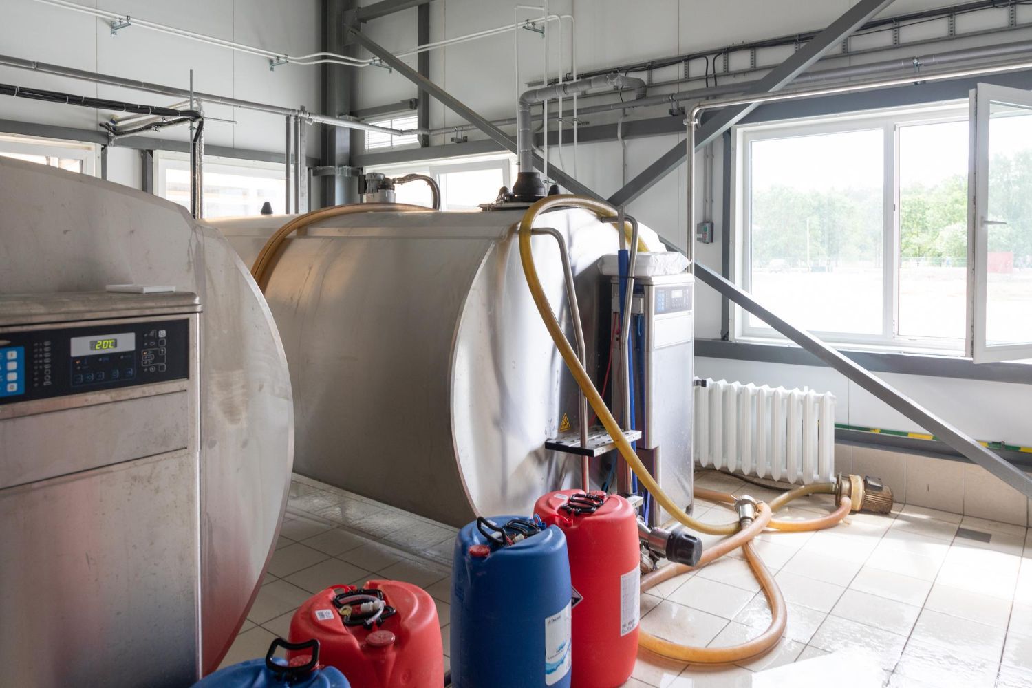 A room with a lot of tanks and barrels in it.