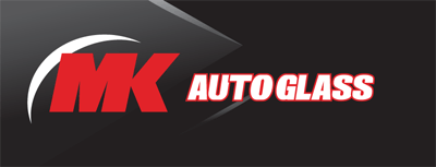 a mk auto glass logo on a black background