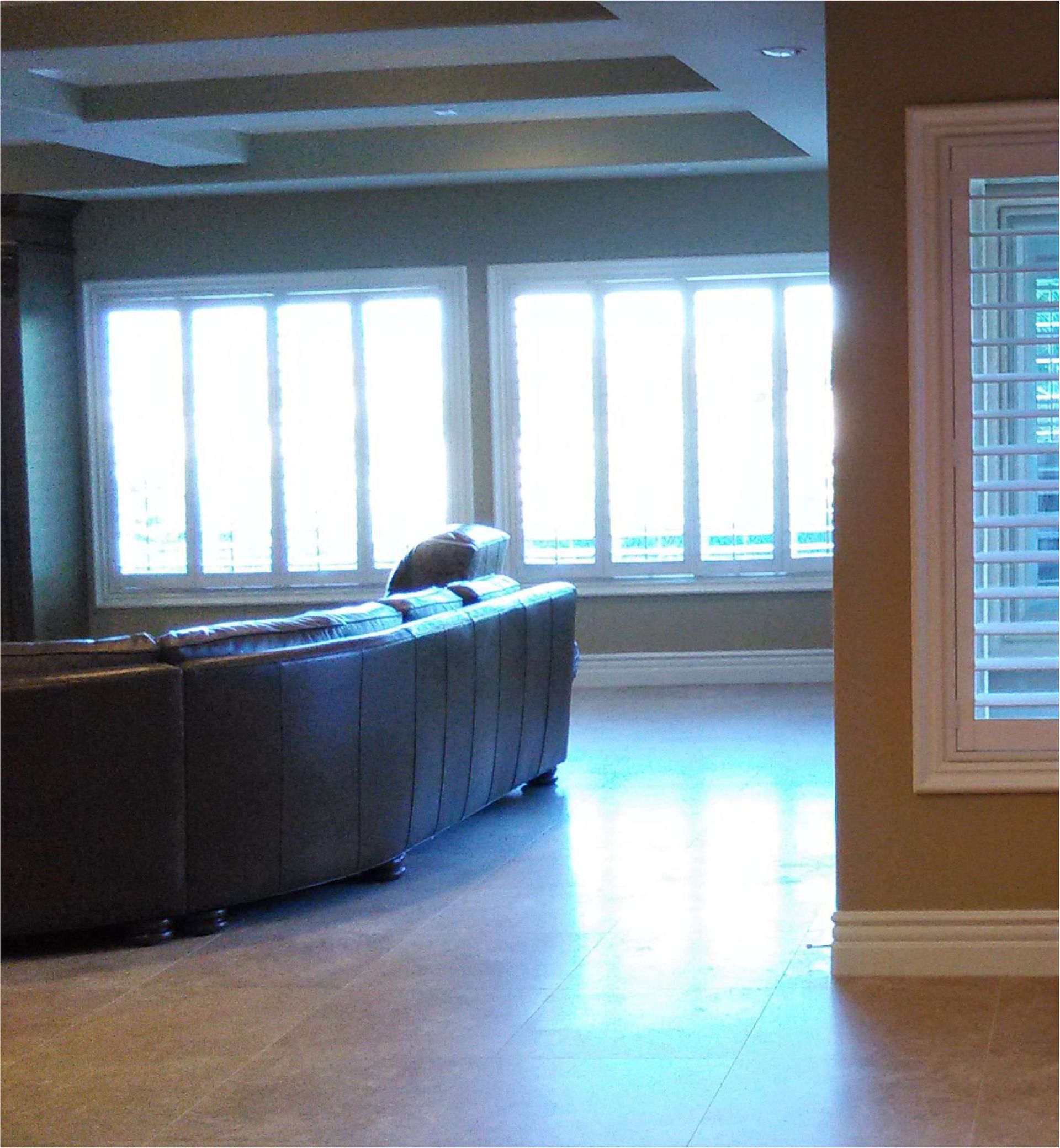 A living room with a couch and a window