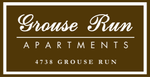 Grouse Run Apartments sign on brown background with white border and text, “4738 Grouse Run”