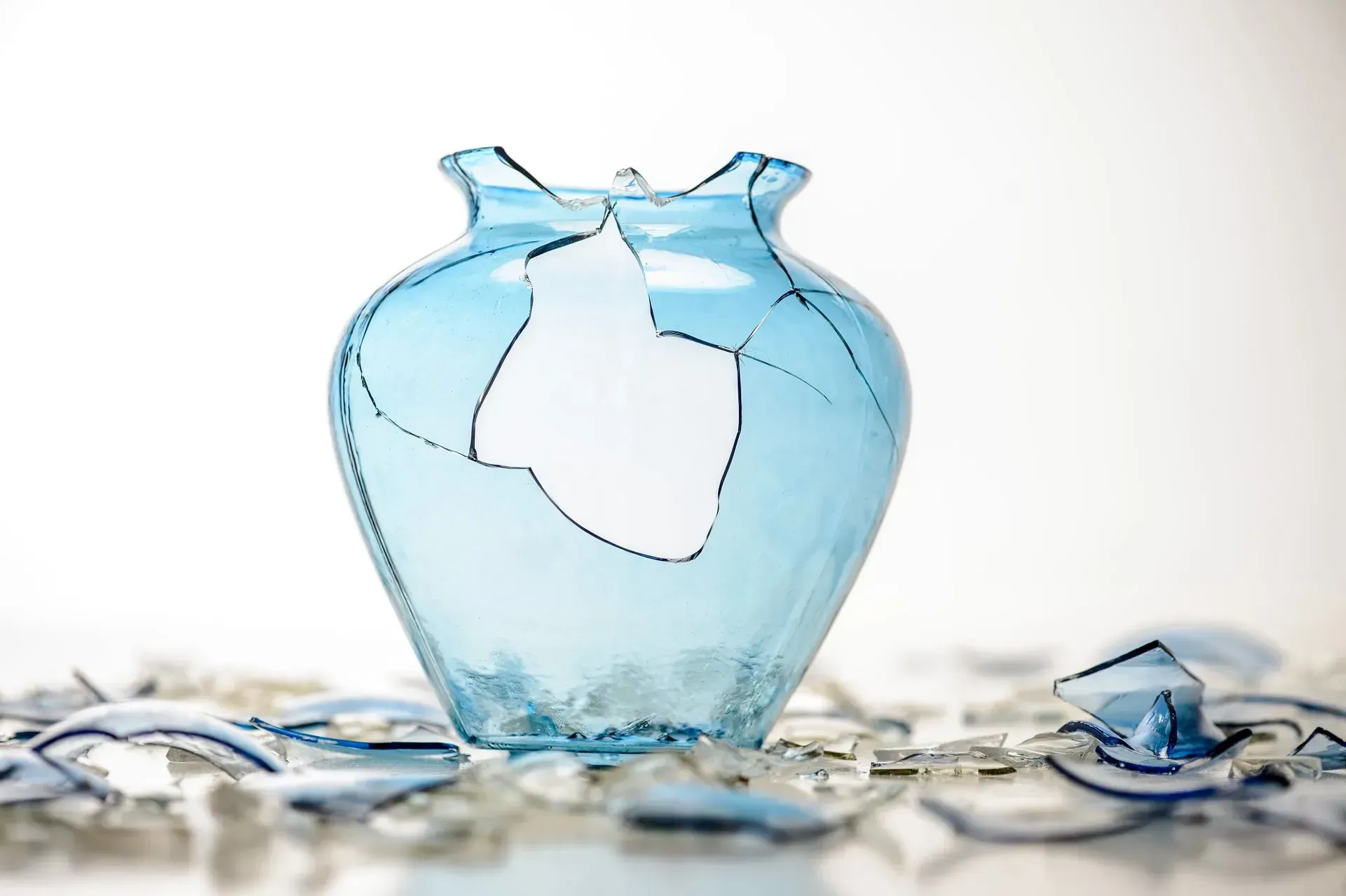 Broken blue glass vase.