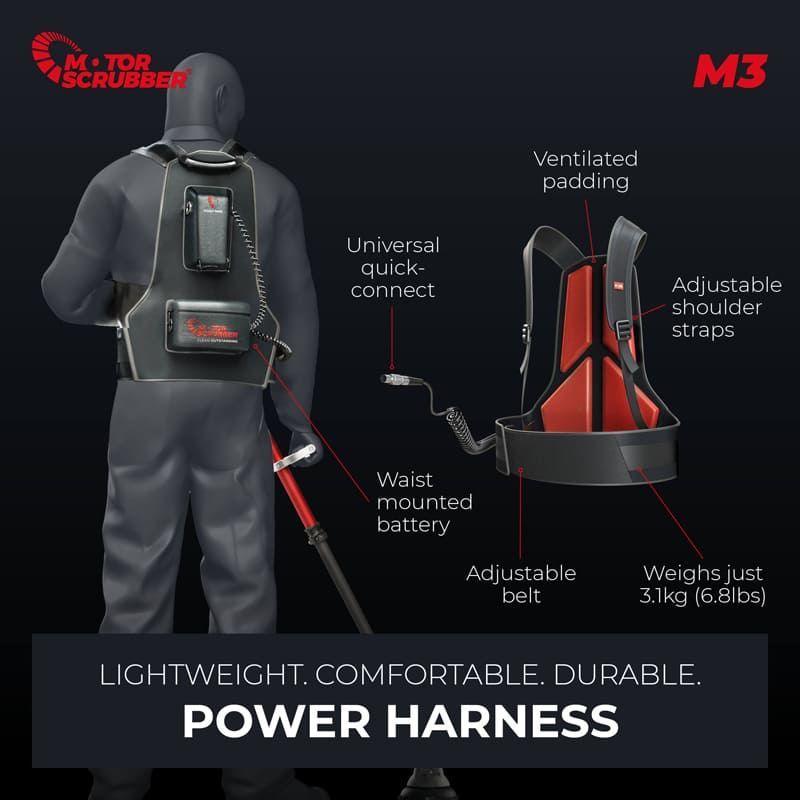 A person wearing a power harness connected to a scrubber. The harness is black and red with adjustable straps and a waist-mounted battery.
