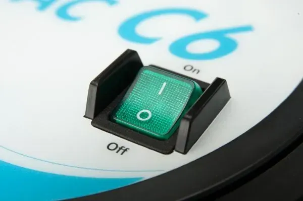 Blue and gray robotic vacuum cleaner with a black camera and antenna.