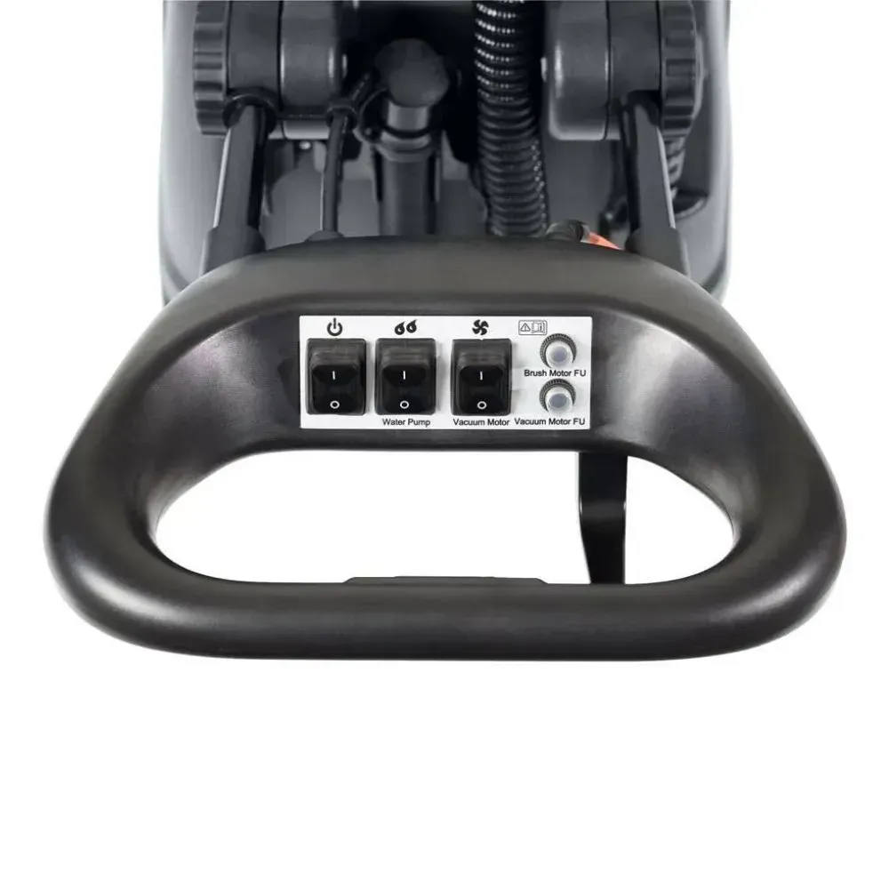 A person filling a dark gray floor cleaning machine with a green hose, near a red cap.