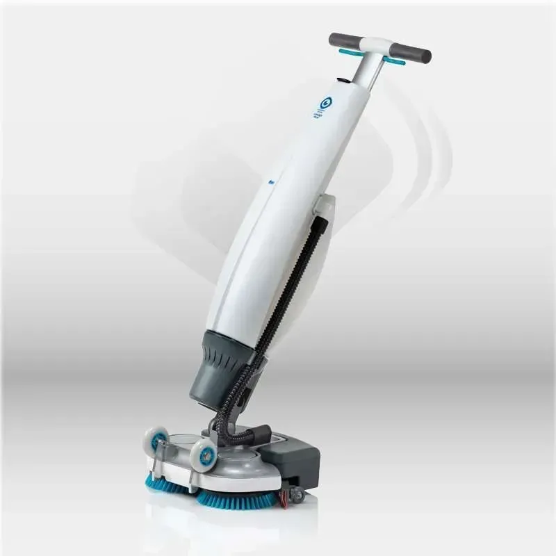 White and blue floor cleaning machine with handle, brushes, and wheels.