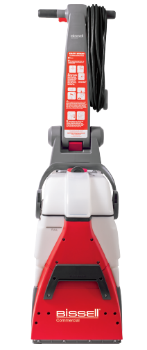 Bissell carpet cleaner, red and gray, with a black cord wrapped on the handle, standing upright.