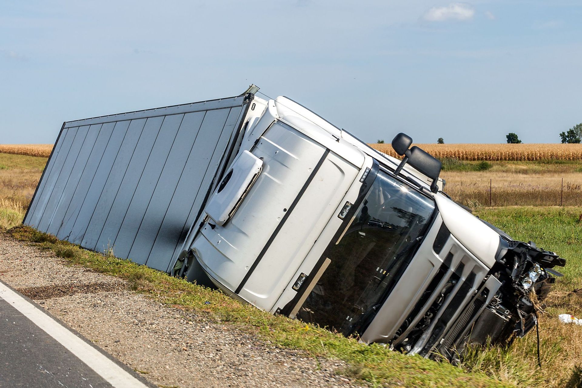 A group of people are sitting at a table drinking coffee.