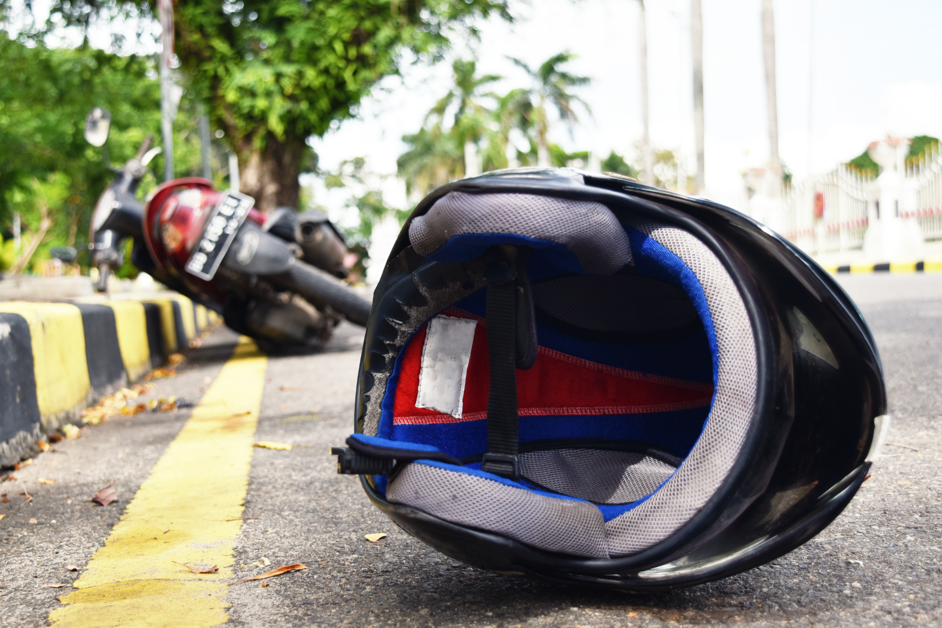A white cadillac convertible is parked on the side of the road.