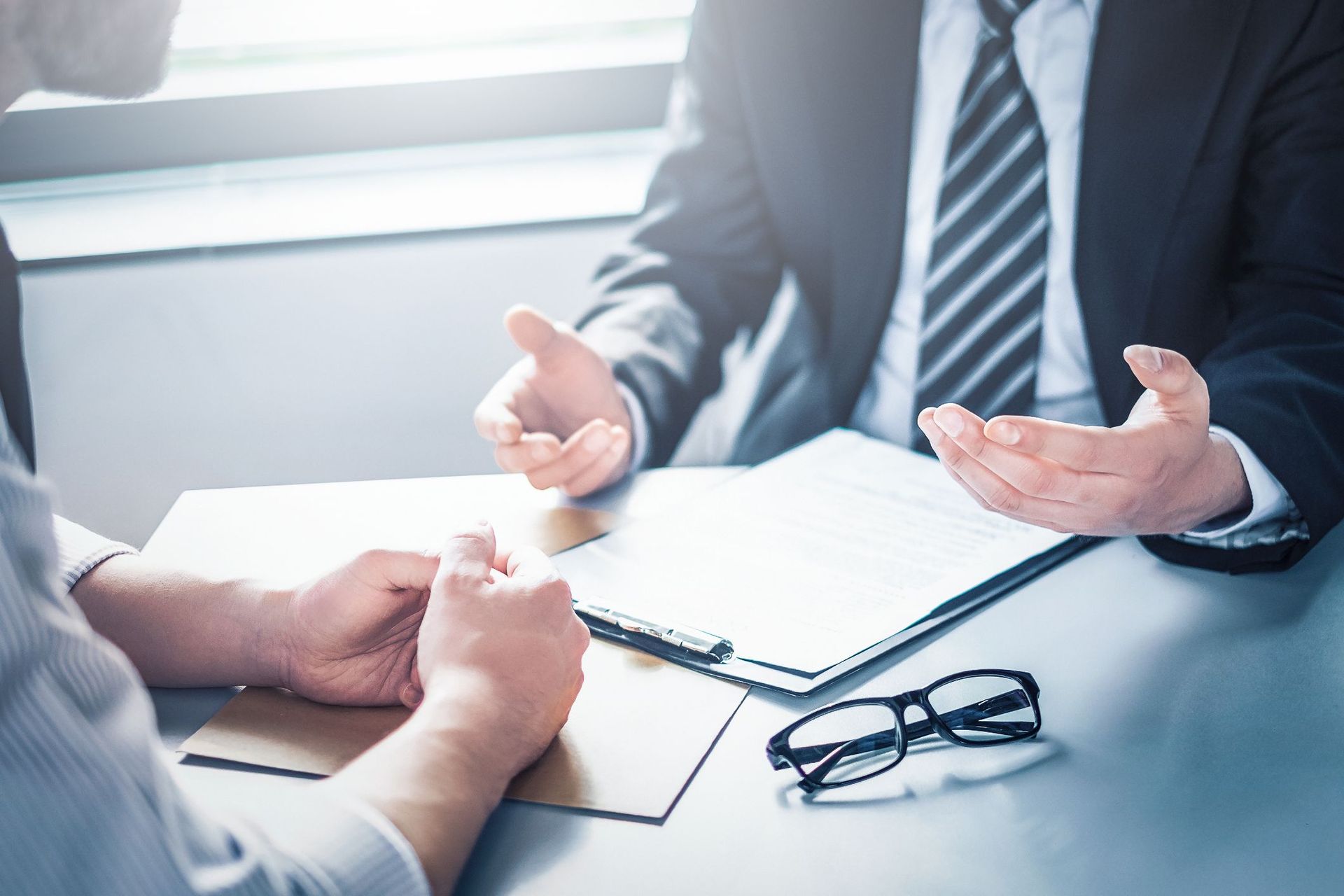 A car with a broken windshield is parked on the side of the road.