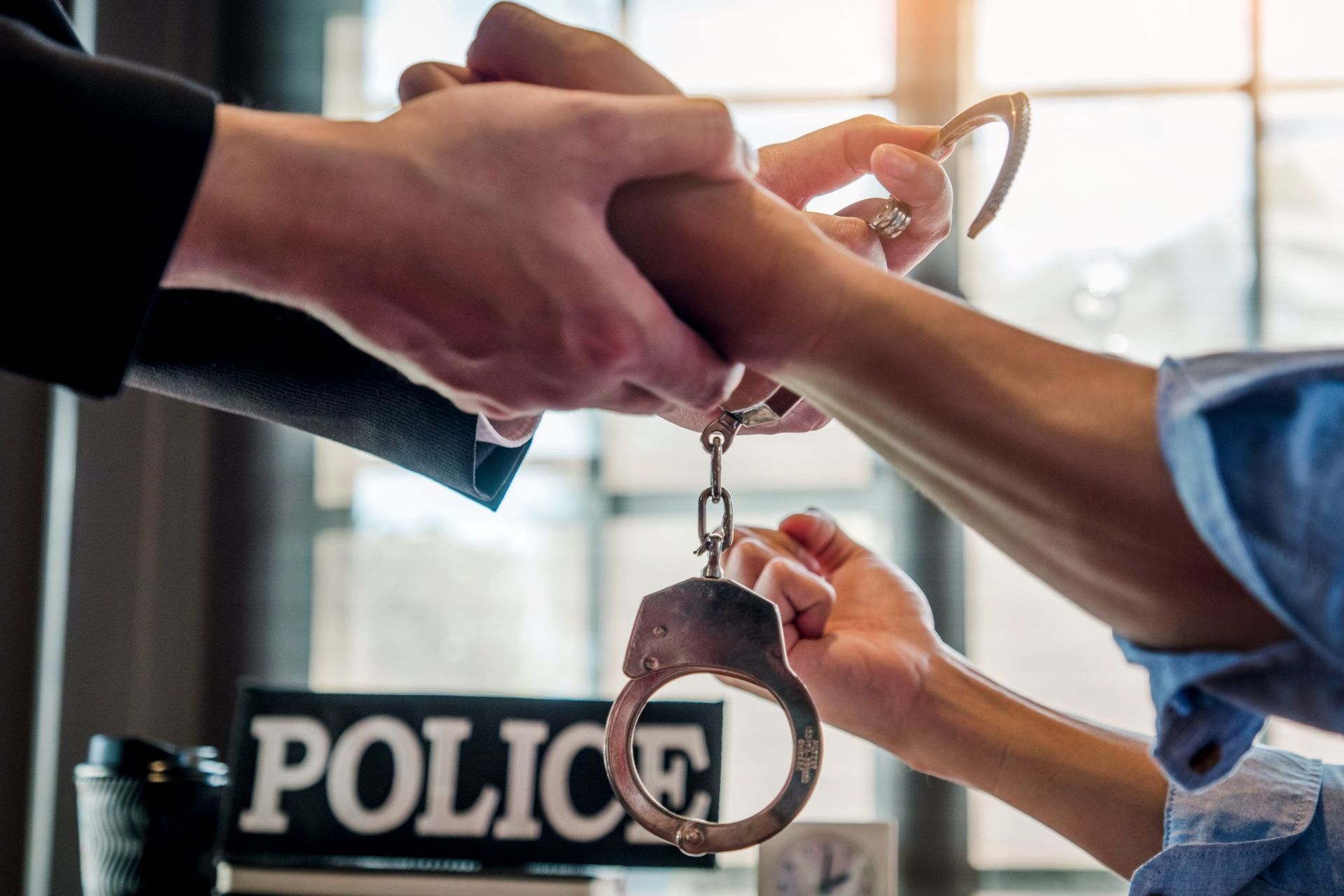 A car with a broken windshield is parked on the side of the road.