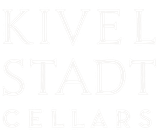 A white logo for kivel stadt cellars on a white background.