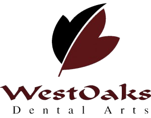 the logo for Westoaks dental arts has a leaf on it .