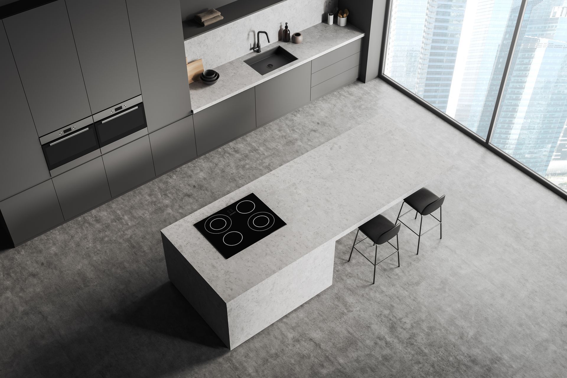 Modern gray kitchen with island and two stools. Induction cooktop, window with cityscape.