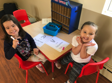 Girls Drawing At Desk, Child Care in San Francisco CA