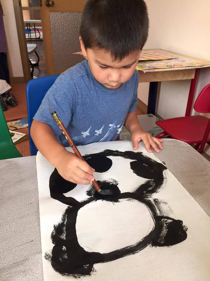 Child Painting with Brush, Preschool Center in Marin CA