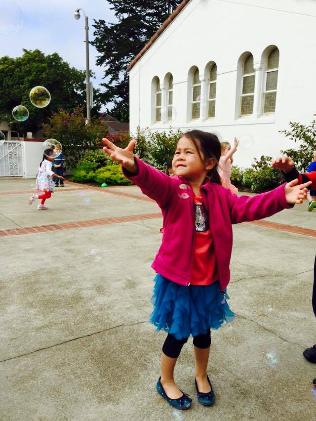 Child Playing with Bubbles, Preschool Center in Marin CA
